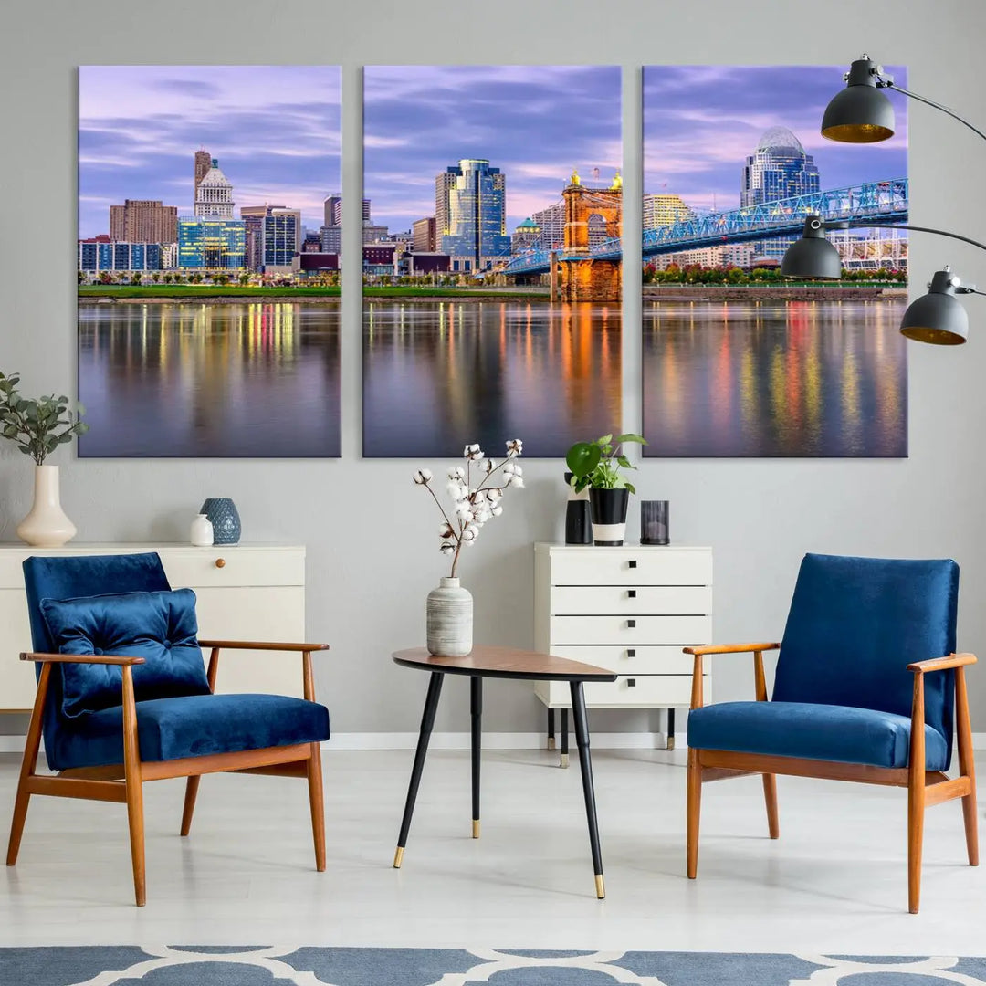 The room features the Cincinnati City Lights Sunset Purple Cloudy Skyline Cityscape View Wall Art Canvas Print, showcasing a breathtaking skyline reflecting on the river. Each piece is created with museum-quality canvas, includes UV-protective coating, and comes ready to hang.