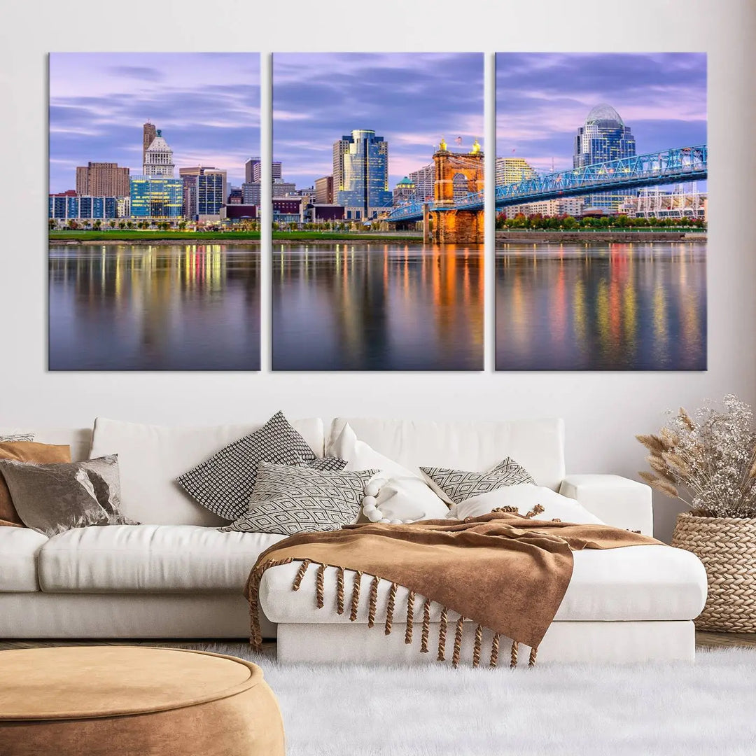 The room features the Cincinnati City Lights Sunset Purple Cloudy Skyline Cityscape View Wall Art Canvas Print, showcasing a breathtaking skyline reflecting on the river. Each piece is created with museum-quality canvas, includes UV-protective coating, and comes ready to hang.