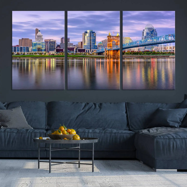 The room features the Cincinnati City Lights Sunset Purple Cloudy Skyline Cityscape View Wall Art Canvas Print, showcasing a breathtaking skyline reflecting on the river. Each piece is created with museum-quality canvas, includes UV-protective coating, and comes ready to hang.