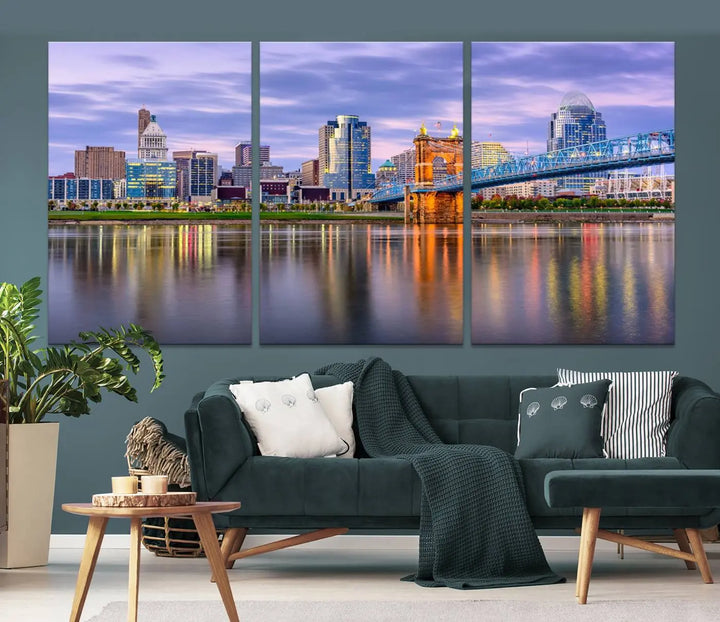 The room features the Cincinnati City Lights Sunset Purple Cloudy Skyline Cityscape View Wall Art Canvas Print, showcasing a breathtaking skyline reflecting on the river. Each piece is created with museum-quality canvas, includes UV-protective coating, and comes ready to hang.