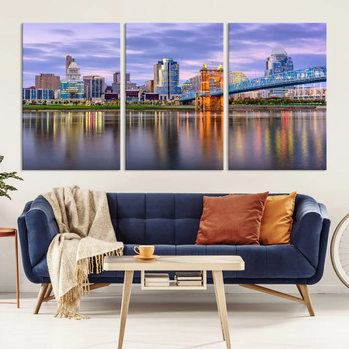 The room features the Cincinnati City Lights Sunset Purple Cloudy Skyline Cityscape View Wall Art Canvas Print, showcasing a breathtaking skyline reflecting on the river. Each piece is created with museum-quality canvas, includes UV-protective coating, and comes ready to hang.