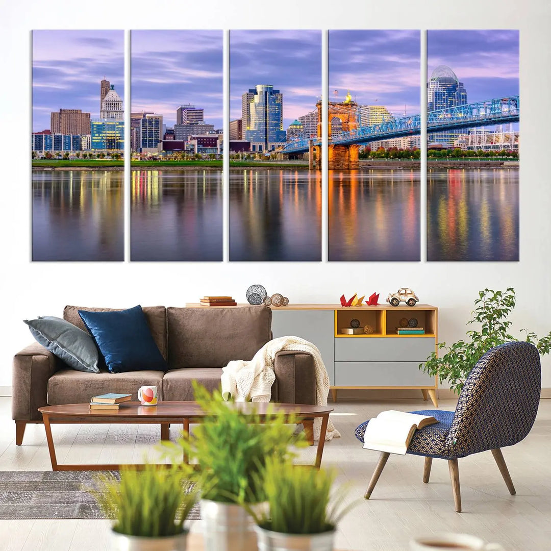 The room features the Cincinnati City Lights Sunset Purple Cloudy Skyline Cityscape View Wall Art Canvas Print, showcasing a breathtaking skyline reflecting on the river. Each piece is created with museum-quality canvas, includes UV-protective coating, and comes ready to hang.