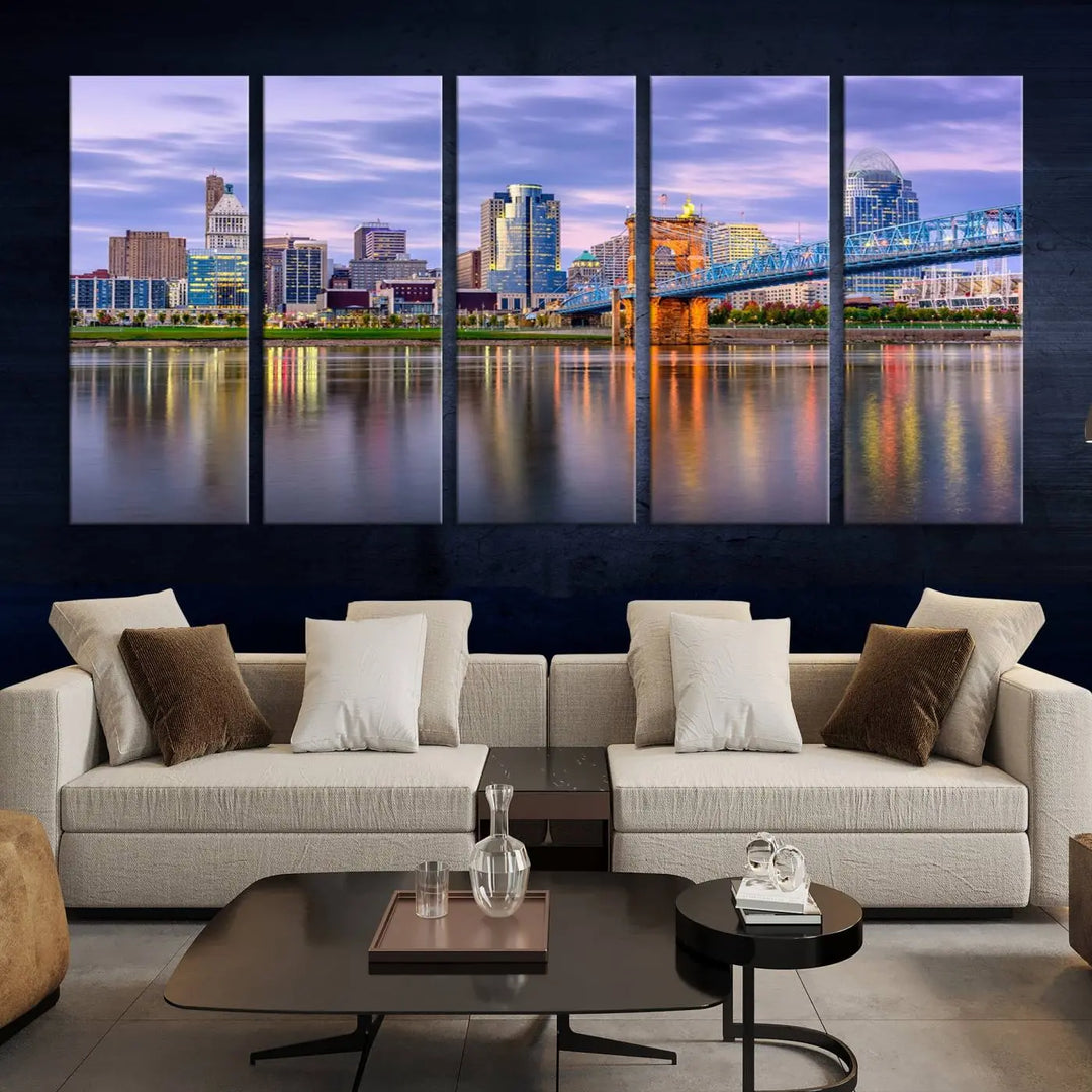 The room features the Cincinnati City Lights Sunset Purple Cloudy Skyline Cityscape View Wall Art Canvas Print, showcasing a breathtaking skyline reflecting on the river. Each piece is created with museum-quality canvas, includes UV-protective coating, and comes ready to hang.