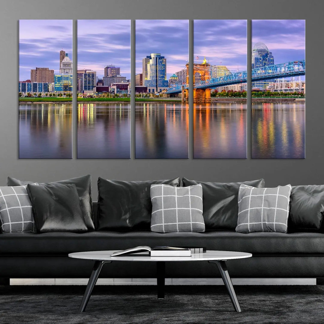 The room features the Cincinnati City Lights Sunset Purple Cloudy Skyline Cityscape View Wall Art Canvas Print, showcasing a breathtaking skyline reflecting on the river. Each piece is created with museum-quality canvas, includes UV-protective coating, and comes ready to hang.