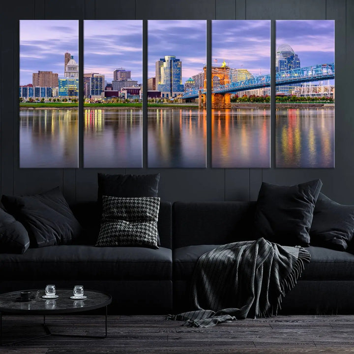 The room features the Cincinnati City Lights Sunset Purple Cloudy Skyline Cityscape View Wall Art Canvas Print, showcasing a breathtaking skyline reflecting on the river. Each piece is created with museum-quality canvas, includes UV-protective coating, and comes ready to hang.