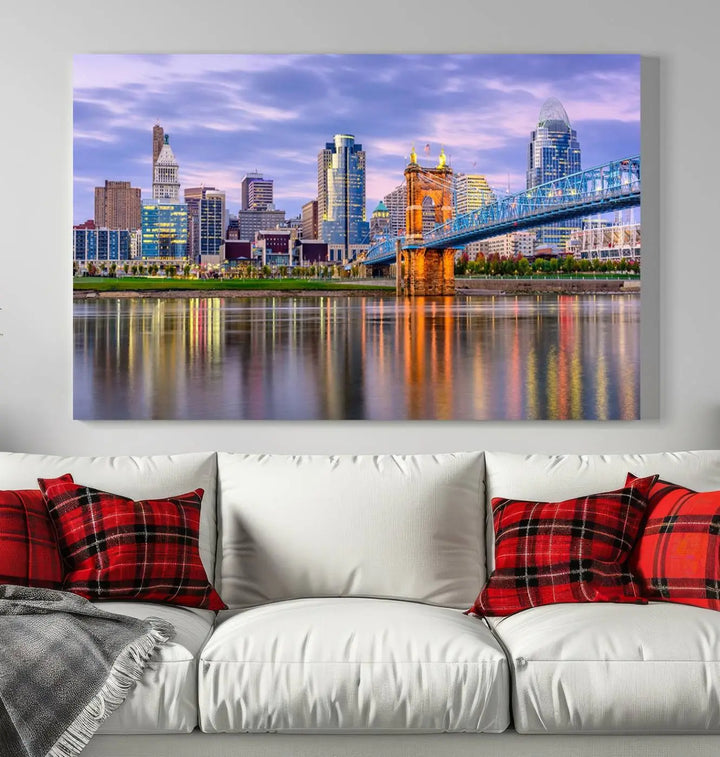 The wall art titled "Cincinnati City Lights Sunset Purple Cloudy Skyline Cityscape View" is beautifully printed on museum-quality canvases with a UV-protective coating and is ready to hang.