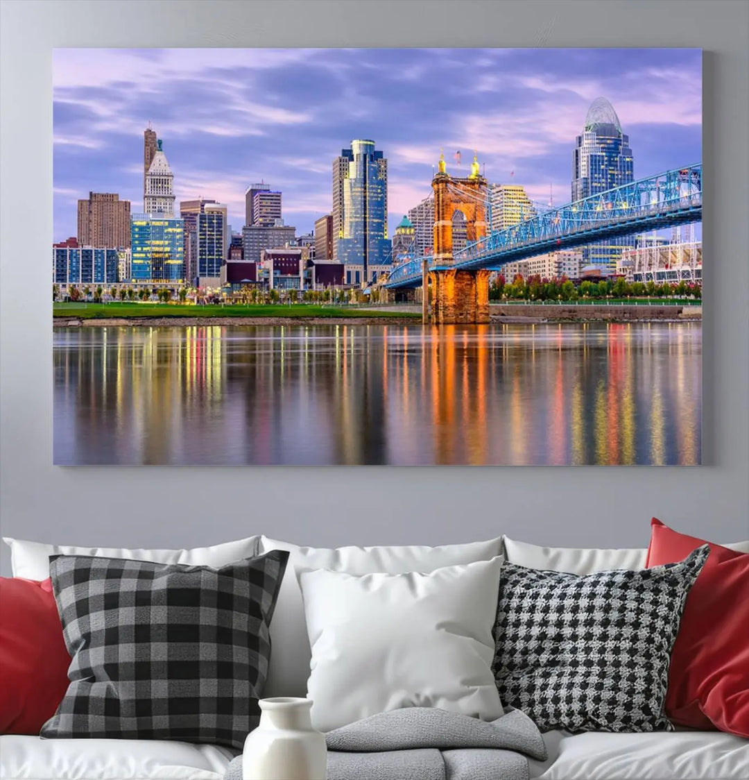 The wall art titled "Cincinnati City Lights Sunset Purple Cloudy Skyline Cityscape View" is beautifully printed on museum-quality canvases with a UV-protective coating and is ready to hang.