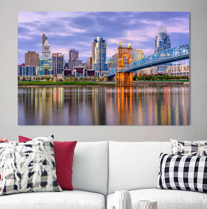 The wall art titled "Cincinnati City Lights Sunset Purple Cloudy Skyline Cityscape View" is beautifully printed on museum-quality canvases with a UV-protective coating and is ready to hang.