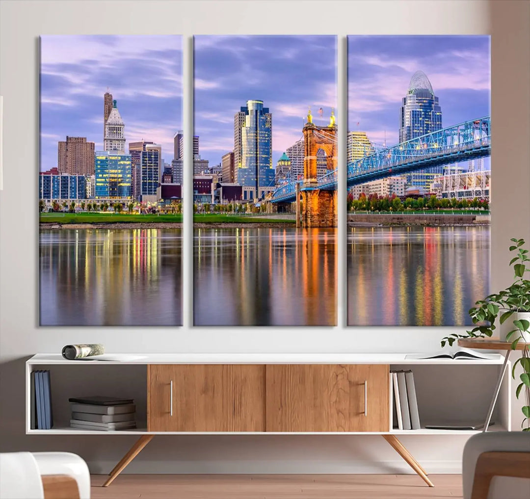 The wall art titled "Cincinnati City Lights Sunset Purple Cloudy Skyline Cityscape View" is beautifully printed on museum-quality canvases with a UV-protective coating and is ready to hang.