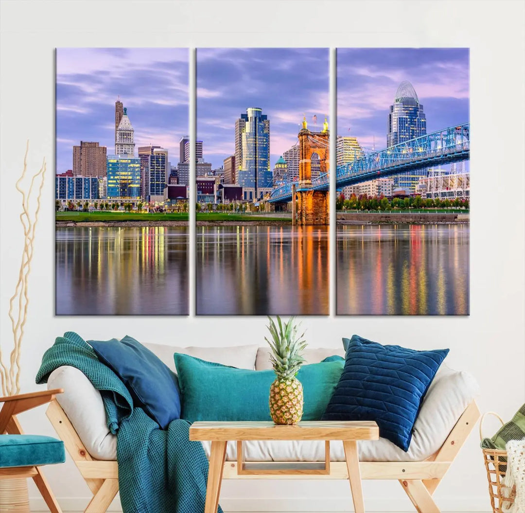 The wall art titled "Cincinnati City Lights Sunset Purple Cloudy Skyline Cityscape View" is beautifully printed on museum-quality canvases with a UV-protective coating and is ready to hang.