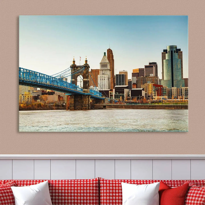 The Cincinnati City Morning Skyline Cityscape View Wall Art Canvas Print features three-panel museum-quality canvases depicting a city skyline with a bridge over a river. This gallery-wrapped artwork ensures an elegant finish and enduring beauty.