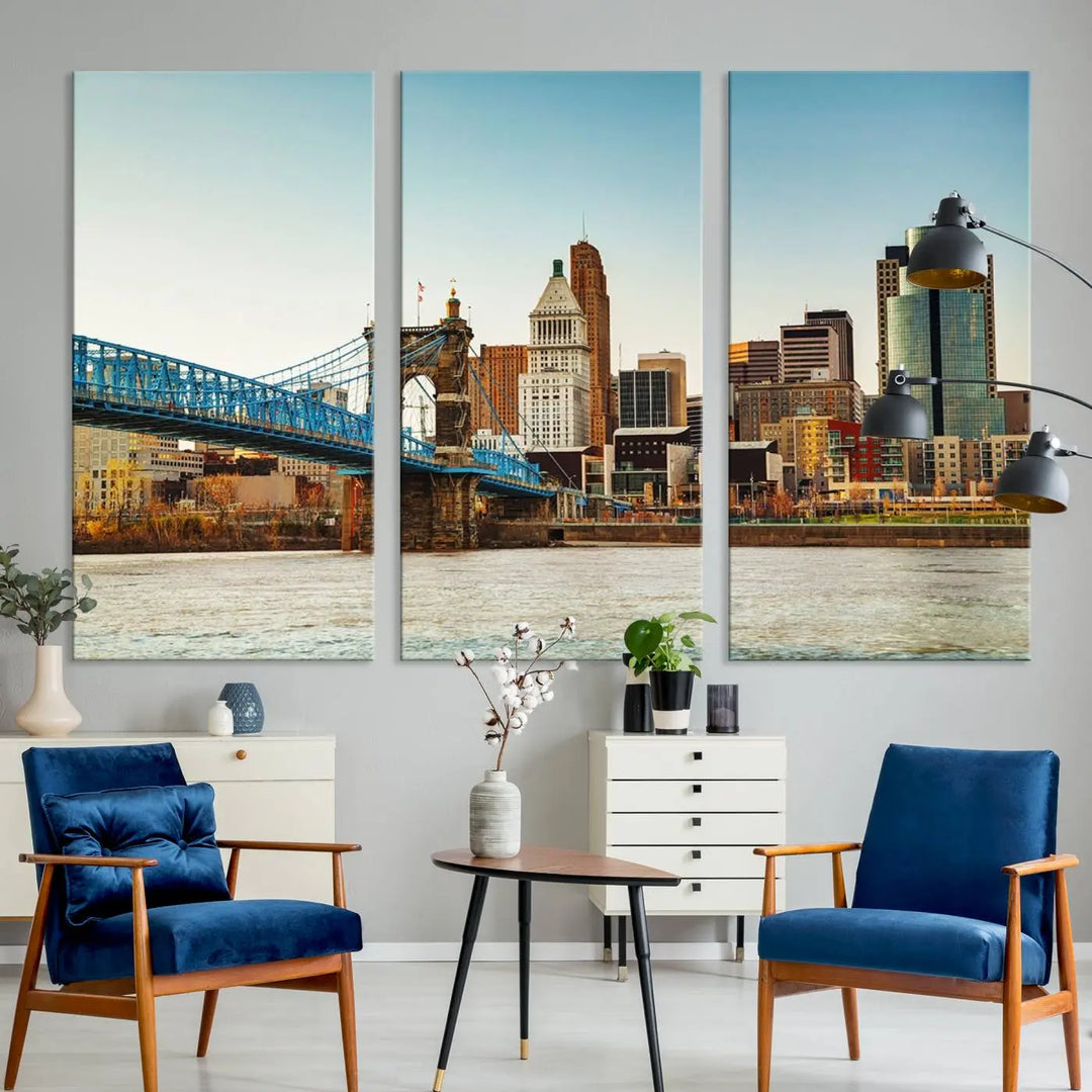 The Cincinnati City Morning Skyline Cityscape View Wall Art Canvas Print features three-panel museum-quality canvases depicting a city skyline with a bridge over a river. This gallery-wrapped artwork ensures an elegant finish and enduring beauty.