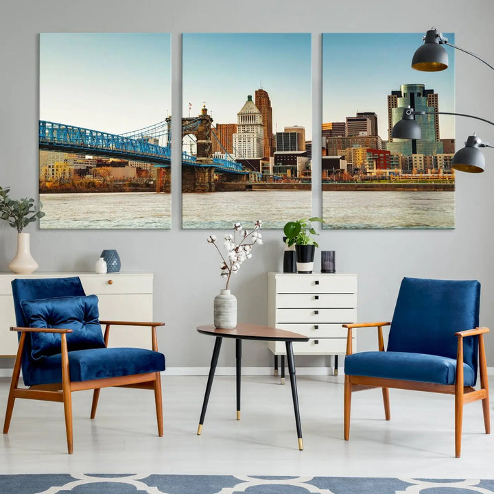 The Cincinnati City Morning Skyline Cityscape View Wall Art Canvas Print features three-panel museum-quality canvases depicting a city skyline with a bridge over a river. This gallery-wrapped artwork ensures an elegant finish and enduring beauty.