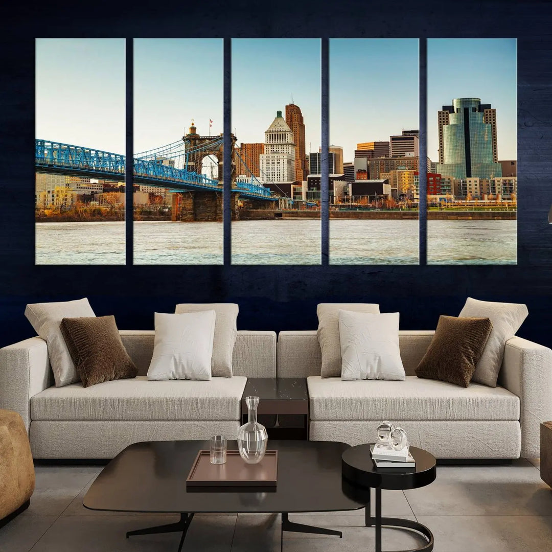 The Cincinnati City Morning Skyline Cityscape View Wall Art Canvas Print features three-panel museum-quality canvases depicting a city skyline with a bridge over a river. This gallery-wrapped artwork ensures an elegant finish and enduring beauty.