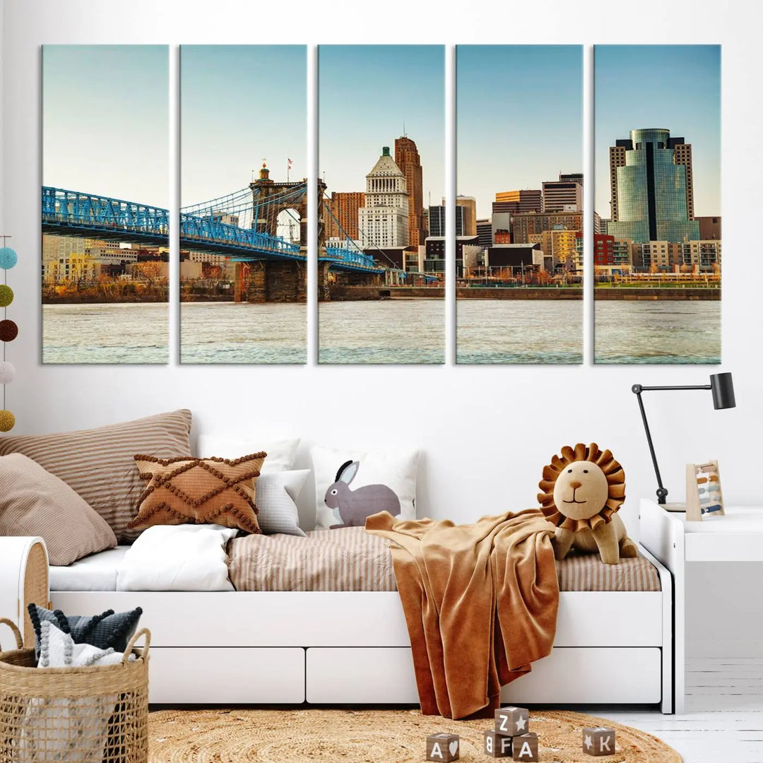 The Cincinnati City Morning Skyline Cityscape View Wall Art Canvas Print features three-panel museum-quality canvases depicting a city skyline with a bridge over a river. This gallery-wrapped artwork ensures an elegant finish and enduring beauty.