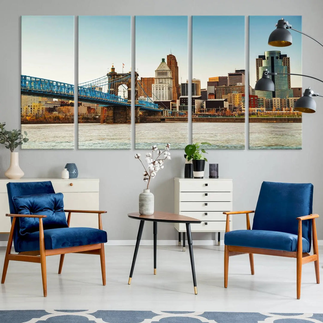 The Cincinnati City Morning Skyline Cityscape View Wall Art Canvas Print features three-panel museum-quality canvases depicting a city skyline with a bridge over a river. This gallery-wrapped artwork ensures an elegant finish and enduring beauty.