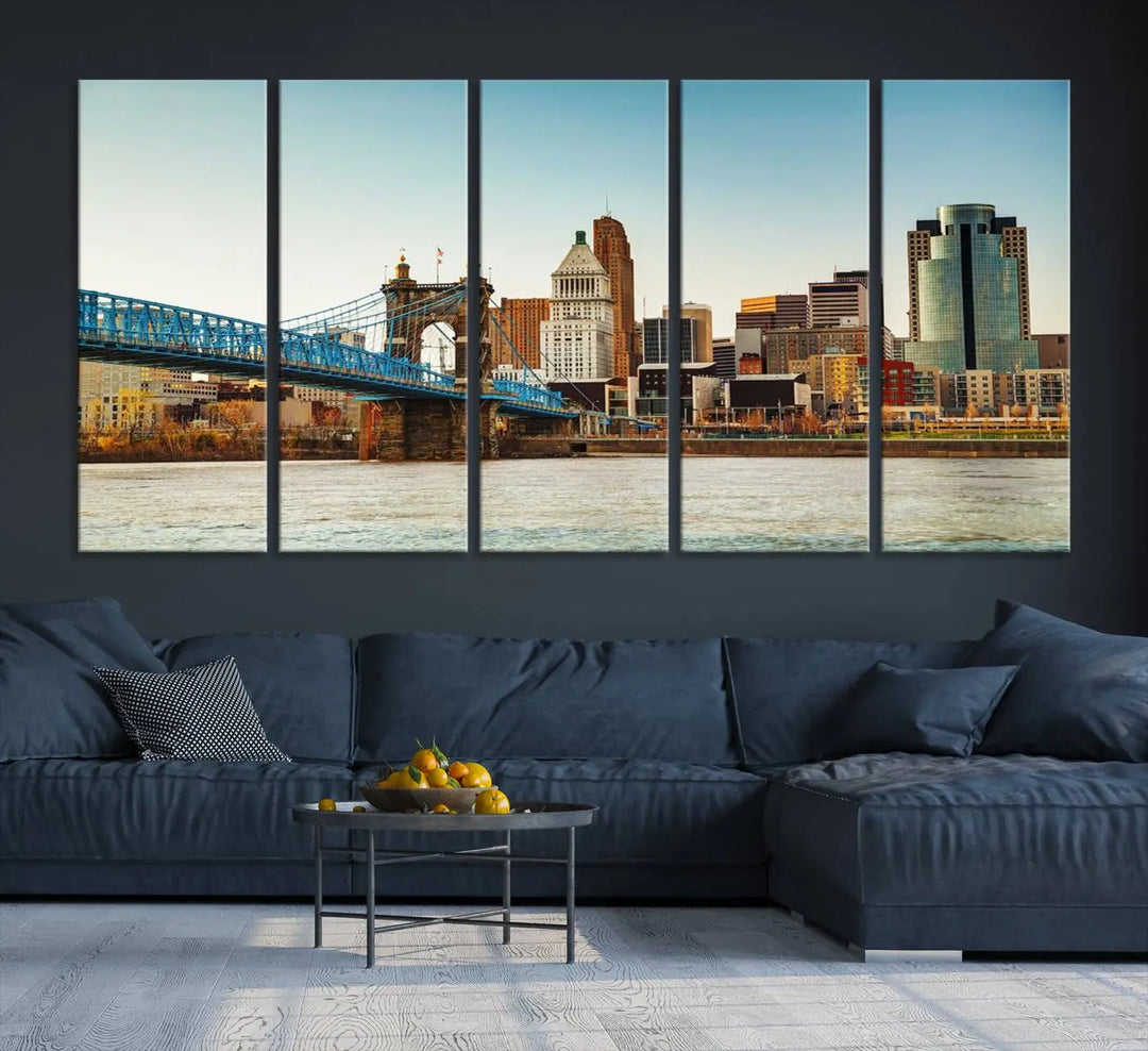 The Cincinnati City Morning Skyline Cityscape View Wall Art Canvas Print features three-panel museum-quality canvases depicting a city skyline with a bridge over a river. This gallery-wrapped artwork ensures an elegant finish and enduring beauty.