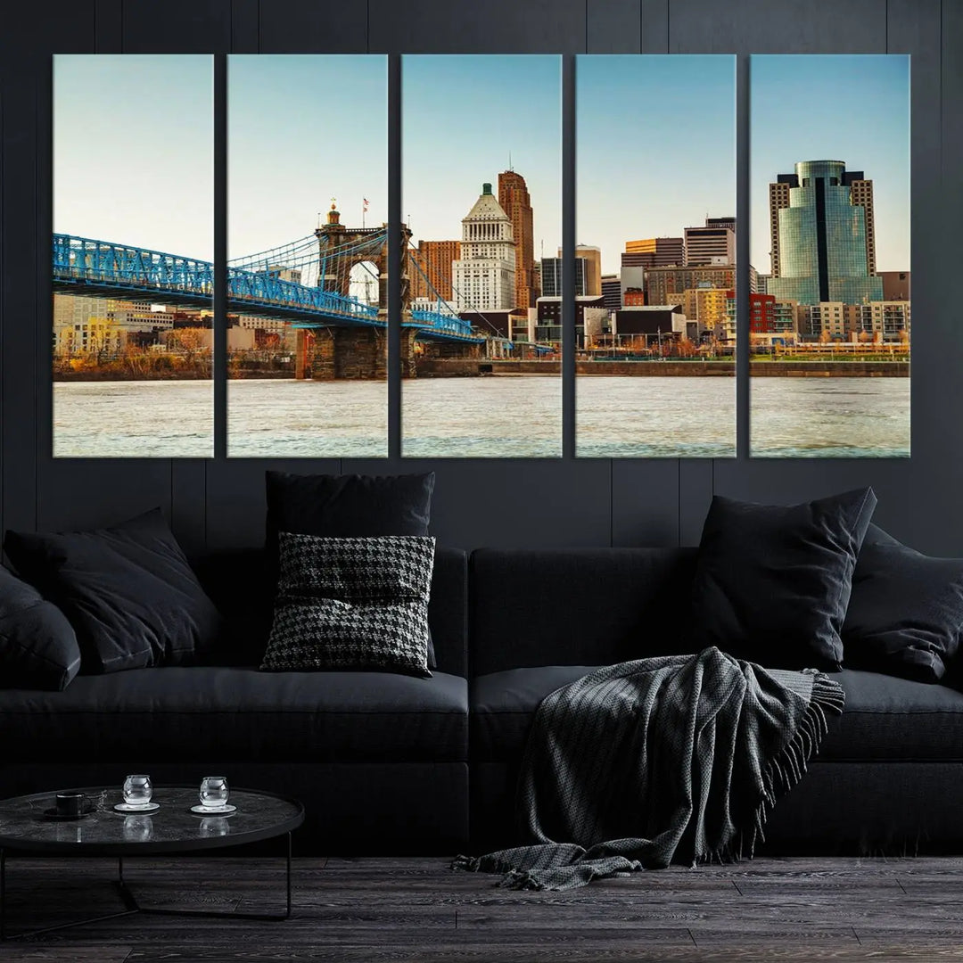 The Cincinnati City Morning Skyline Cityscape View Wall Art Canvas Print features three-panel museum-quality canvases depicting a city skyline with a bridge over a river. This gallery-wrapped artwork ensures an elegant finish and enduring beauty.