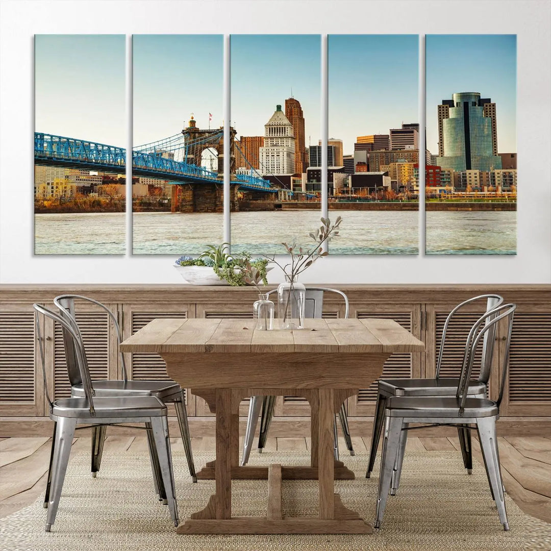 The Cincinnati City Morning Skyline Cityscape View Wall Art Canvas Print features three-panel museum-quality canvases depicting a city skyline with a bridge over a river. This gallery-wrapped artwork ensures an elegant finish and enduring beauty.