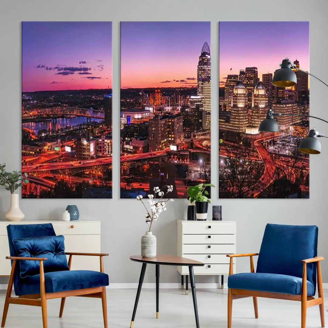 The Cincinnati City Sunset Purple Skyline Cityscape View Wall Art Canvas Print showcases a beautiful cityscape photo at sunset on a gallery-wrapped, museum-quality canvas. It is enhanced with a UV-protective coating to ensure lasting vibrancy and longevity.