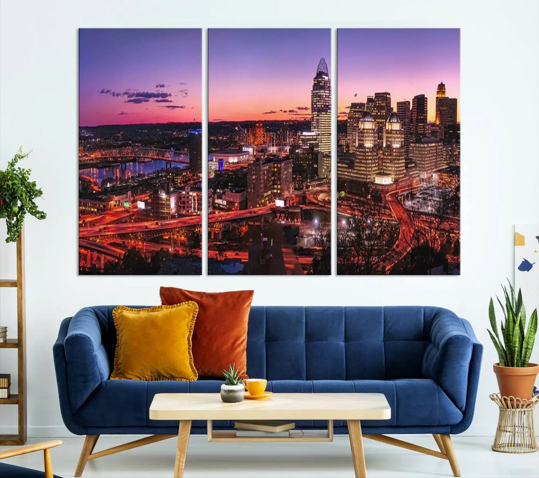 The Cincinnati City Sunset Purple Skyline Cityscape View Wall Art Canvas Print showcases a beautiful cityscape photo at sunset on a gallery-wrapped, museum-quality canvas. It is enhanced with a UV-protective coating to ensure lasting vibrancy and longevity.