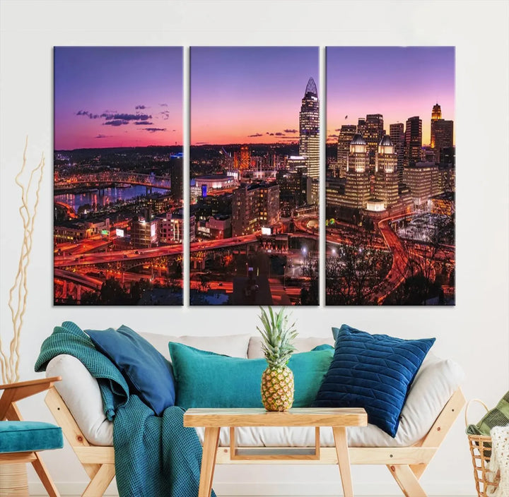 The Cincinnati City Sunset Purple Skyline Cityscape View Wall Art Canvas Print showcases a beautiful cityscape photo at sunset on a gallery-wrapped, museum-quality canvas. It is enhanced with a UV-protective coating to ensure lasting vibrancy and longevity.