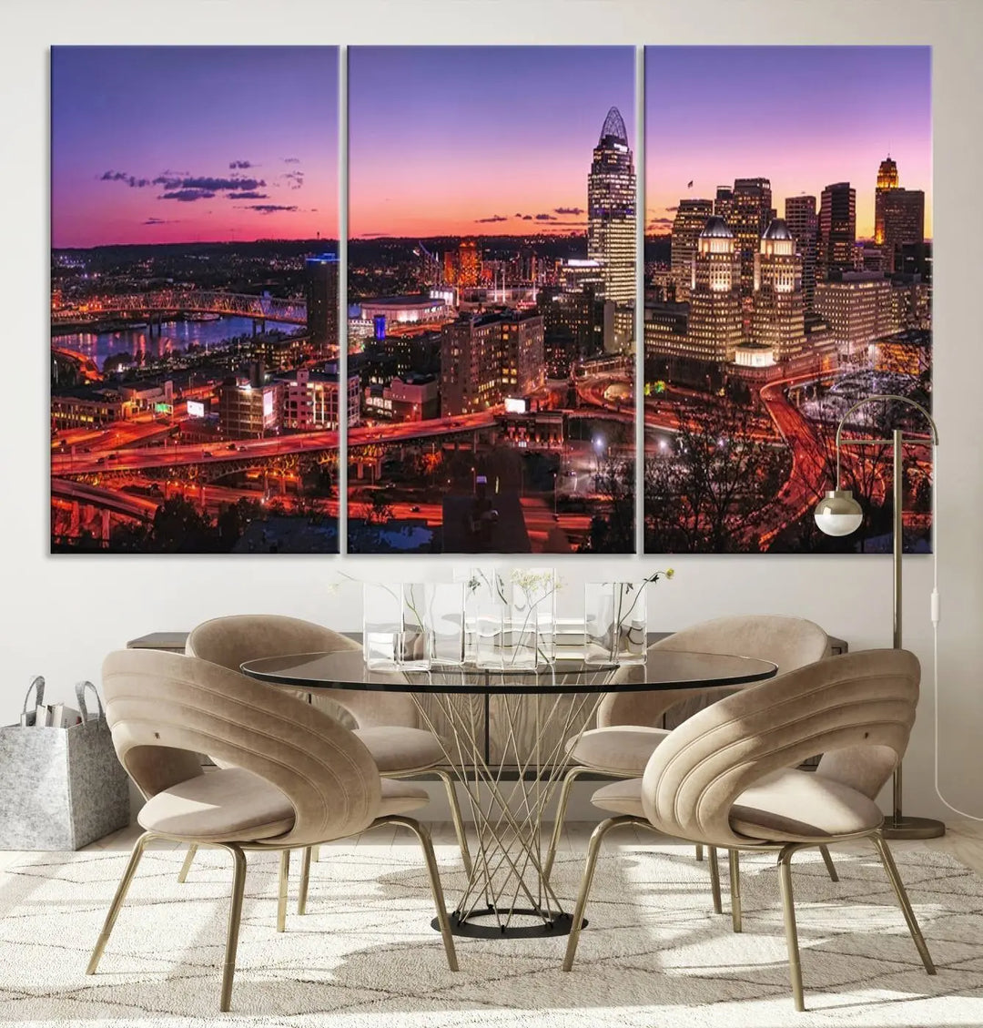 The Cincinnati City Sunset Purple Skyline Cityscape View Wall Art Canvas Print showcases a beautiful cityscape photo at sunset on a gallery-wrapped, museum-quality canvas. It is enhanced with a UV-protective coating to ensure lasting vibrancy and longevity.