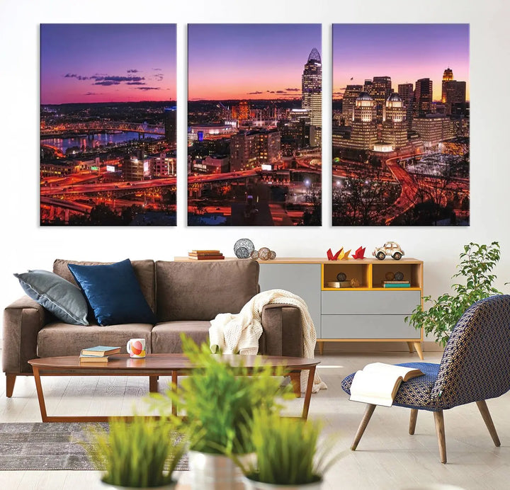 The Cincinnati City Sunset Purple Skyline Cityscape View Wall Art Canvas Print showcases a beautiful cityscape photo at sunset on a gallery-wrapped, museum-quality canvas. It is enhanced with a UV-protective coating to ensure lasting vibrancy and longevity.