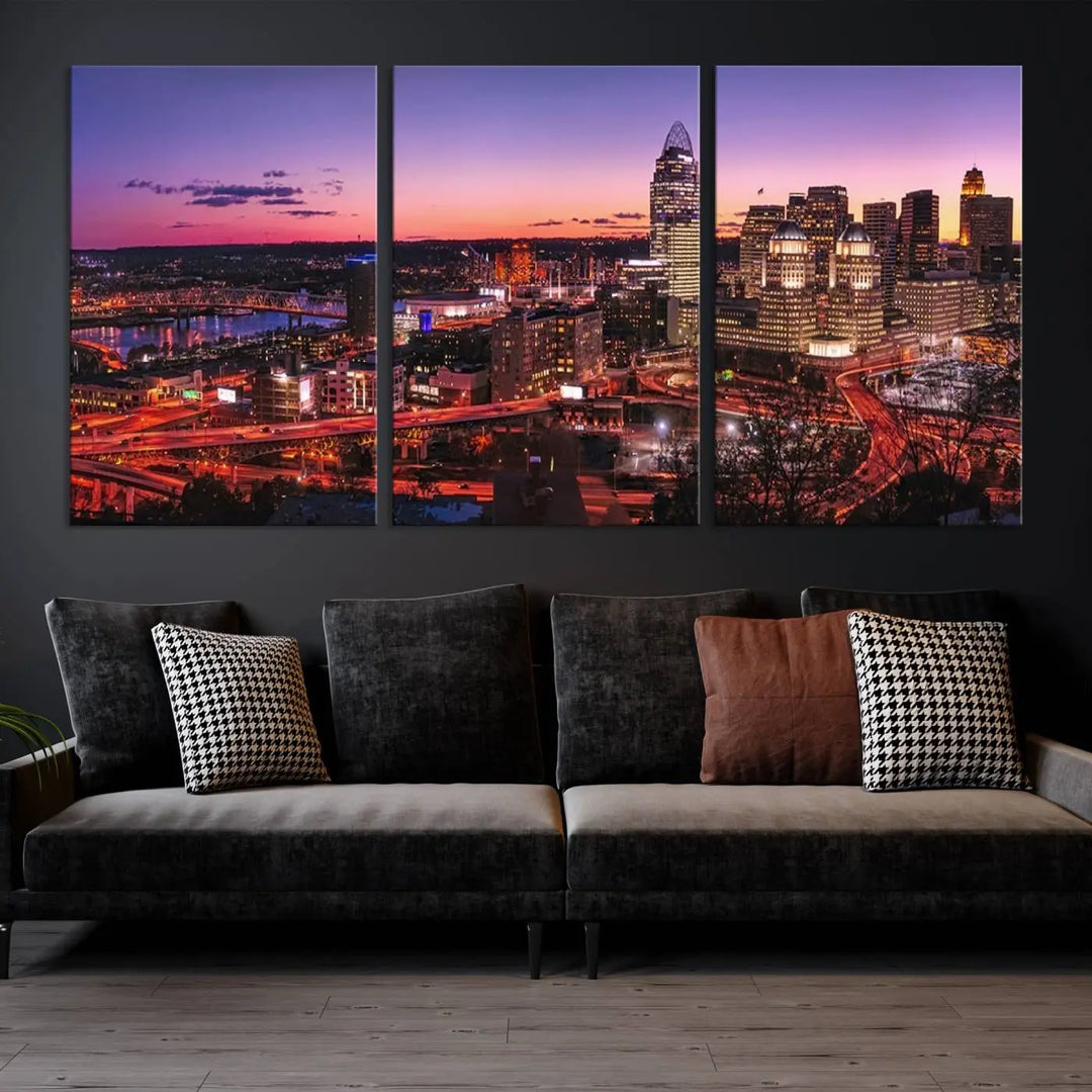 The Cincinnati City Sunset Purple Skyline Cityscape View Wall Art Canvas Print showcases a beautiful cityscape photo at sunset on a gallery-wrapped, museum-quality canvas. It is enhanced with a UV-protective coating to ensure lasting vibrancy and longevity.