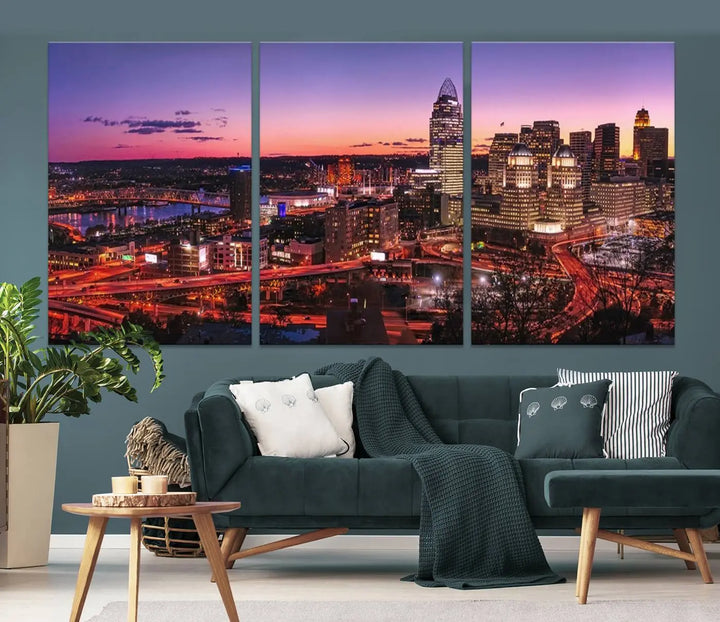 The Cincinnati City Sunset Purple Skyline Cityscape View Wall Art Canvas Print showcases a beautiful cityscape photo at sunset on a gallery-wrapped, museum-quality canvas. It is enhanced with a UV-protective coating to ensure lasting vibrancy and longevity.