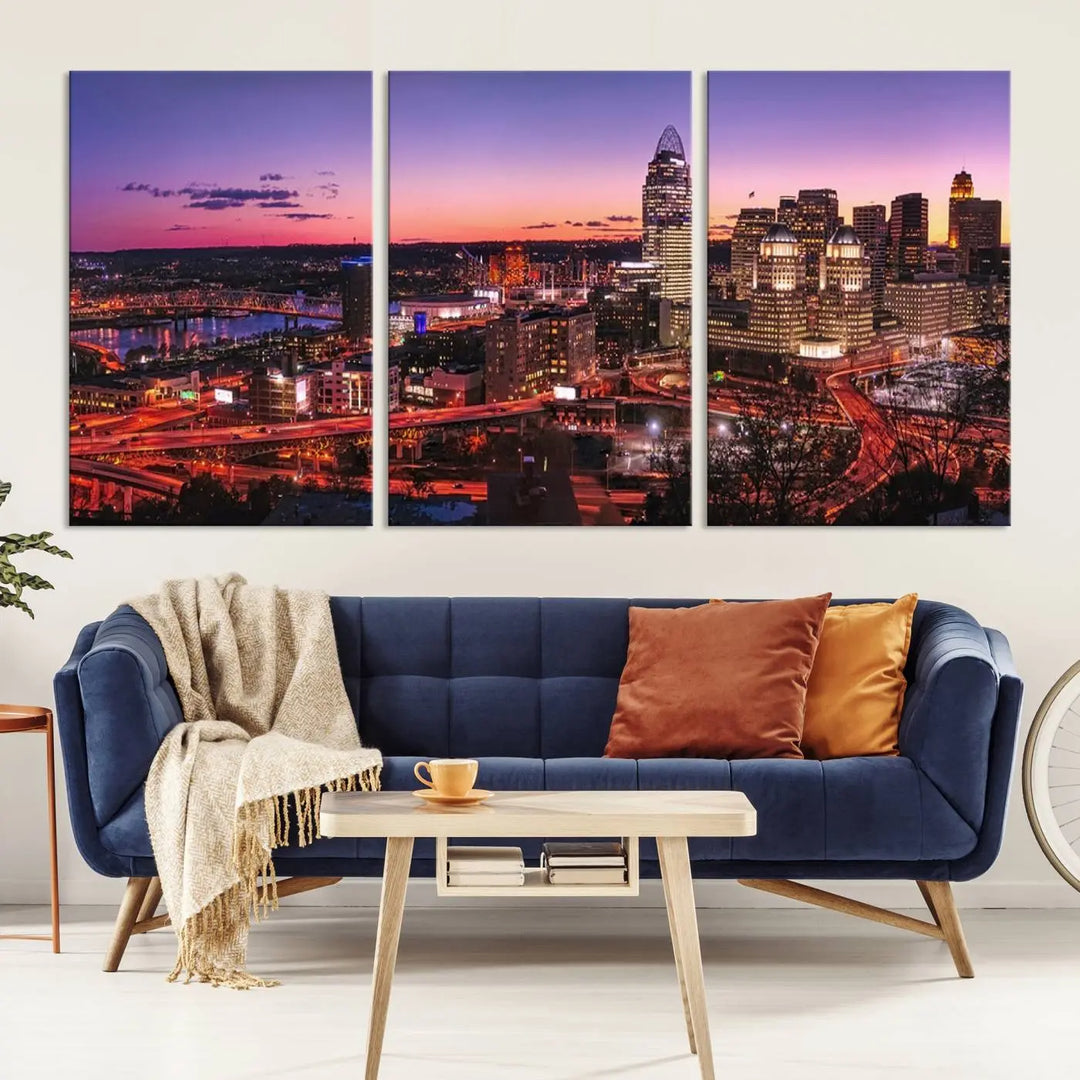 The Cincinnati City Sunset Purple Skyline Cityscape View Wall Art Canvas Print showcases a beautiful cityscape photo at sunset on a gallery-wrapped, museum-quality canvas. It is enhanced with a UV-protective coating to ensure lasting vibrancy and longevity.