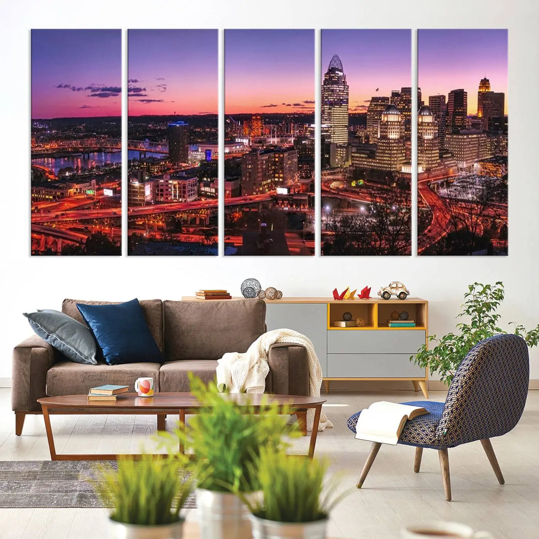 The Cincinnati City Sunset Purple Skyline Cityscape View Wall Art Canvas Print showcases a beautiful cityscape photo at sunset on a gallery-wrapped, museum-quality canvas. It is enhanced with a UV-protective coating to ensure lasting vibrancy and longevity.