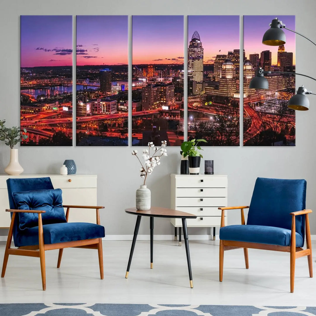 The Cincinnati City Sunset Purple Skyline Cityscape View Wall Art Canvas Print showcases a beautiful cityscape photo at sunset on a gallery-wrapped, museum-quality canvas. It is enhanced with a UV-protective coating to ensure lasting vibrancy and longevity.