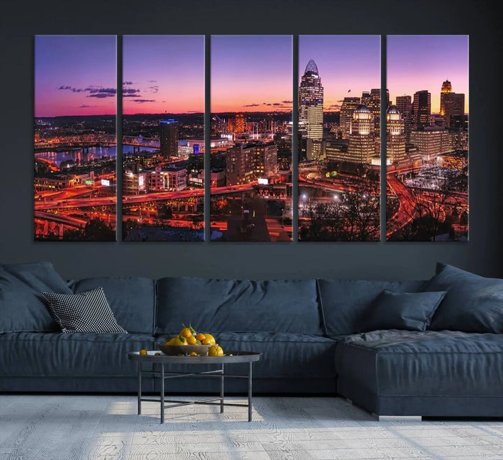 The Cincinnati City Sunset Purple Skyline Cityscape View Wall Art Canvas Print showcases a beautiful cityscape photo at sunset on a gallery-wrapped, museum-quality canvas. It is enhanced with a UV-protective coating to ensure lasting vibrancy and longevity.