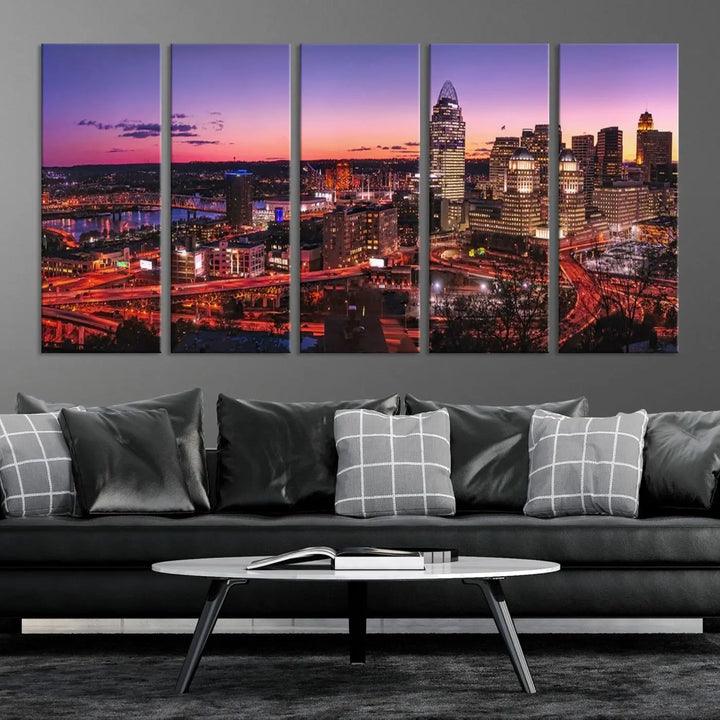 The Cincinnati City Sunset Purple Skyline Cityscape View Wall Art Canvas Print showcases a beautiful cityscape photo at sunset on a gallery-wrapped, museum-quality canvas. It is enhanced with a UV-protective coating to ensure lasting vibrancy and longevity.