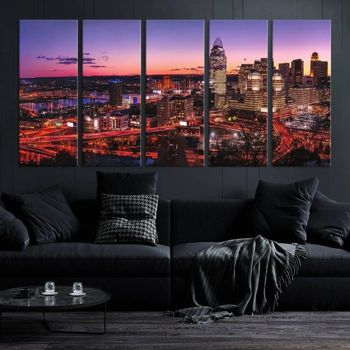 The Cincinnati City Sunset Purple Skyline Cityscape View Wall Art Canvas Print showcases a beautiful cityscape photo at sunset on a gallery-wrapped, museum-quality canvas. It is enhanced with a UV-protective coating to ensure lasting vibrancy and longevity.