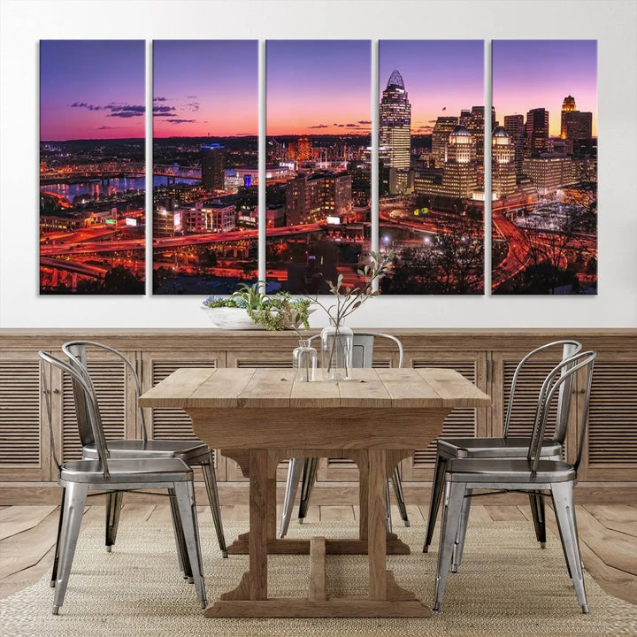 The Cincinnati City Sunset Purple Skyline Cityscape View Wall Art Canvas Print showcases a beautiful cityscape photo at sunset on a gallery-wrapped, museum-quality canvas. It is enhanced with a UV-protective coating to ensure lasting vibrancy and longevity.