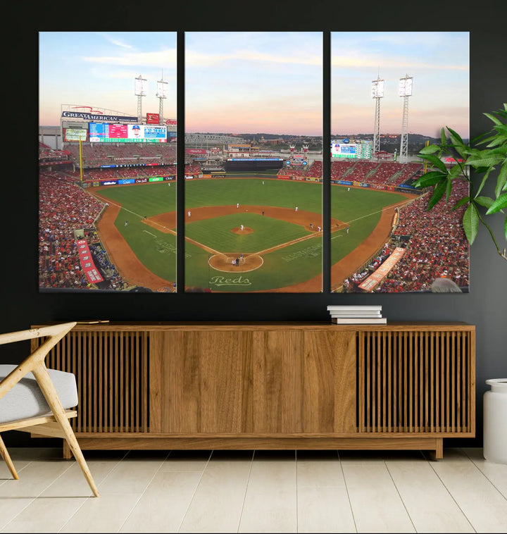 A canvas print of the Cincinnati Reds Baseball Team features a stunning image of the Great American Ball Park at sunset.