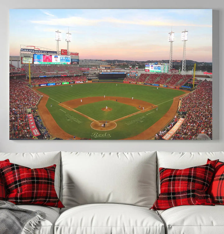 A canvas print of the Cincinnati Reds Baseball Team features a stunning image of the Great American Ball Park at sunset.