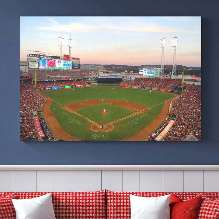 A canvas print of the Cincinnati Reds Baseball Team features a stunning image of the Great American Ball Park at sunset.