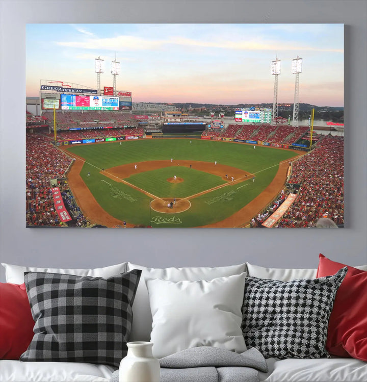 A canvas print of the Cincinnati Reds Baseball Team features a stunning image of the Great American Ball Park at sunset.