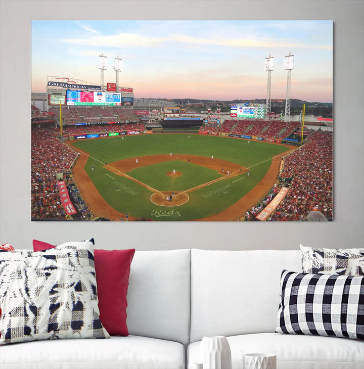 A canvas print of the Cincinnati Reds Baseball Team features a stunning image of the Great American Ball Park at sunset.