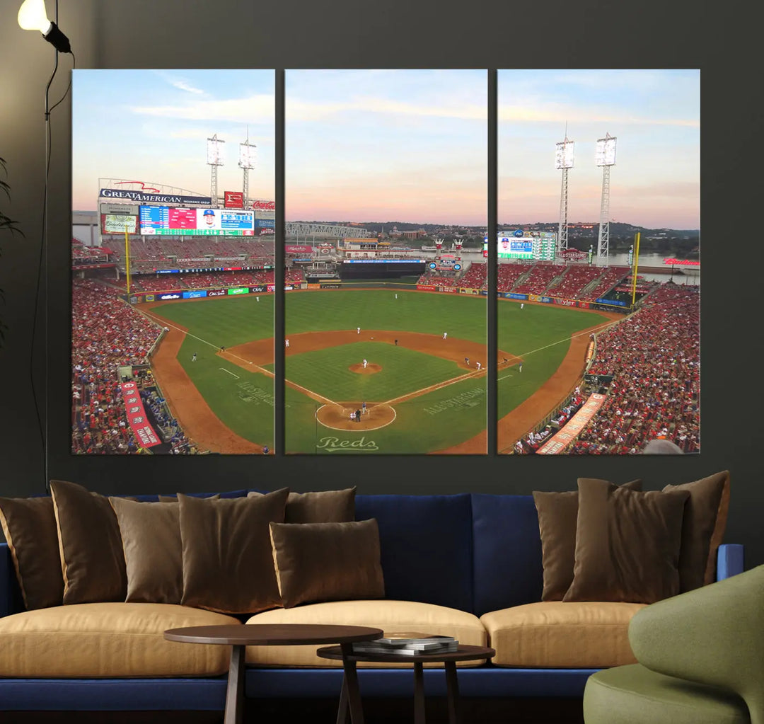 A canvas print of the Cincinnati Reds Baseball Team features a stunning image of the Great American Ball Park at sunset.