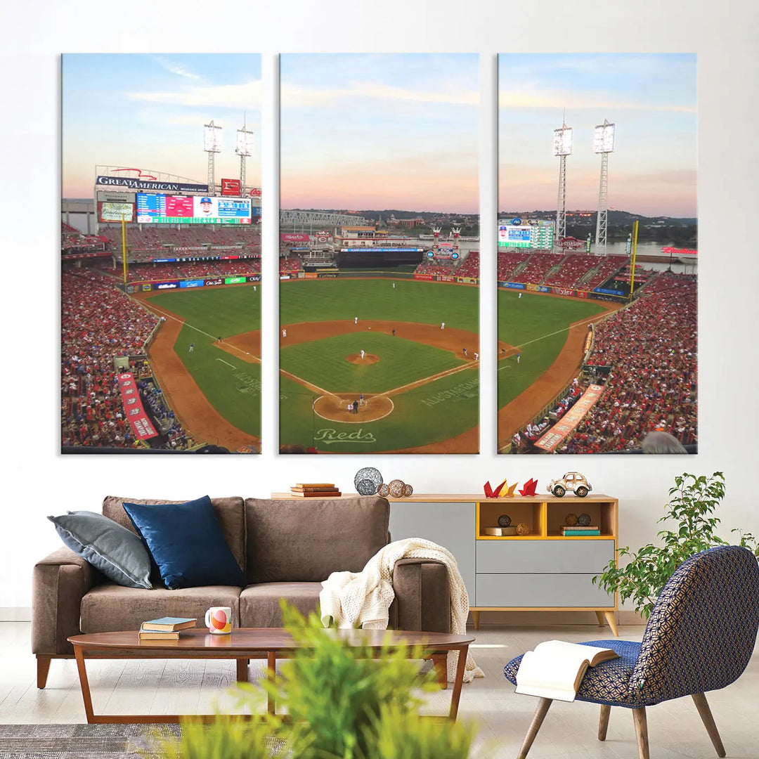 A canvas print of the Cincinnati Reds Baseball Team features a stunning image of the Great American Ball Park at sunset.