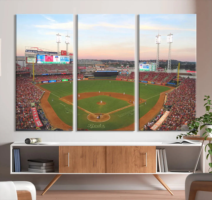 A canvas print of the Cincinnati Reds Baseball Team features a stunning image of the Great American Ball Park at sunset.