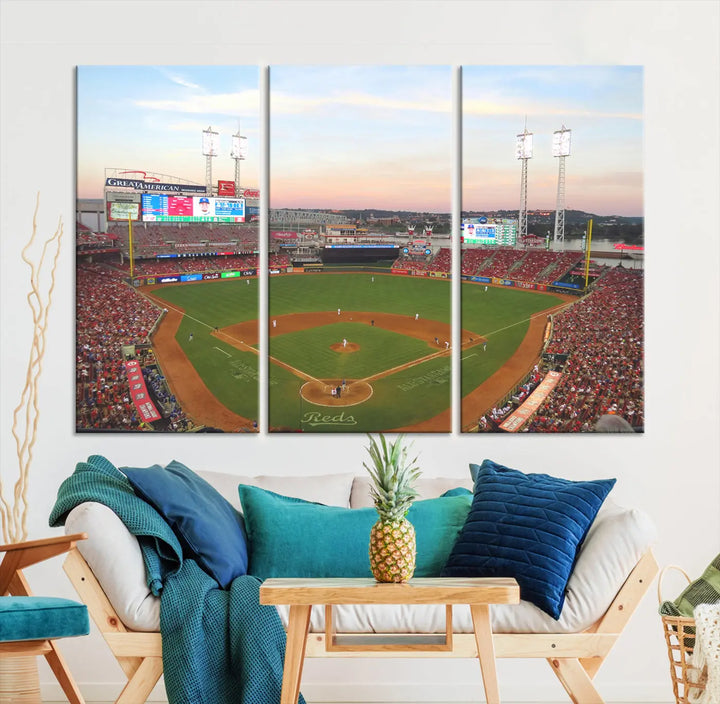 A canvas print of the Cincinnati Reds Baseball Team features a stunning image of the Great American Ball Park at sunset.