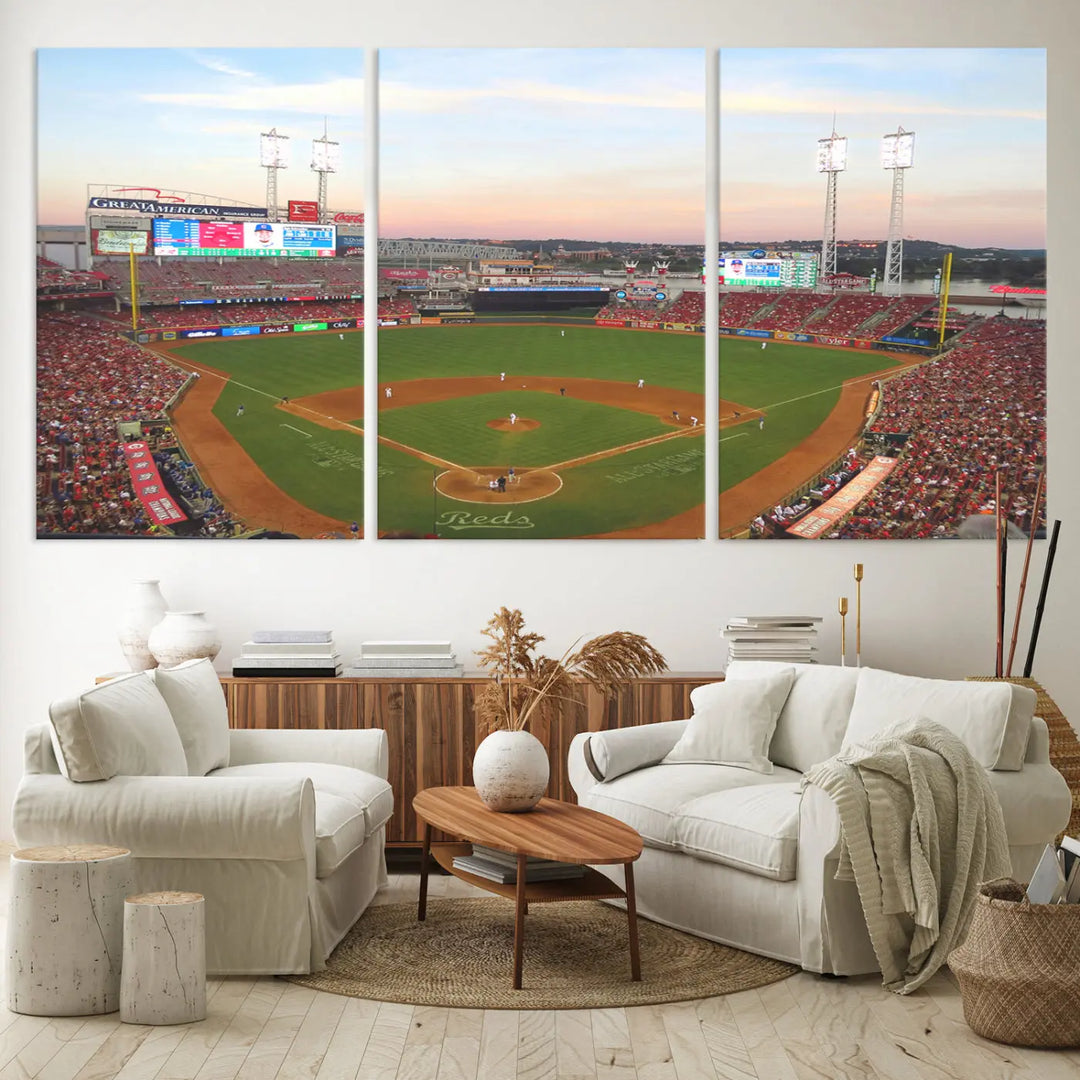 A canvas print of the Cincinnati Reds Baseball Team features a stunning image of the Great American Ball Park at sunset.