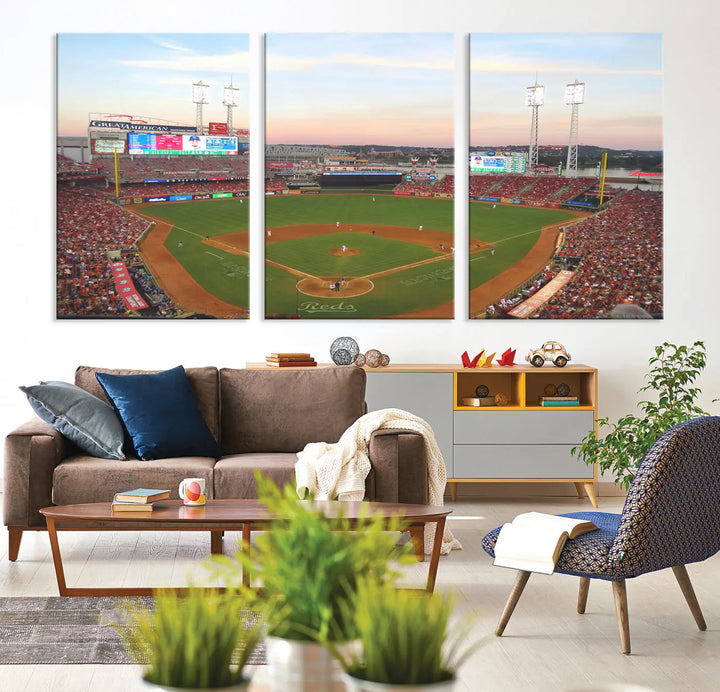 A canvas print of the Cincinnati Reds Baseball Team features a stunning image of the Great American Ball Park at sunset.