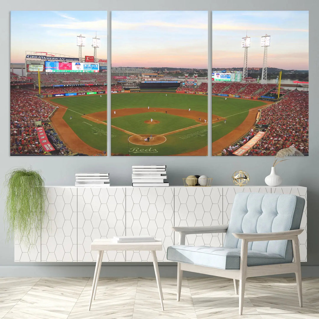 A canvas print of the Cincinnati Reds Baseball Team features a stunning image of the Great American Ball Park at sunset.