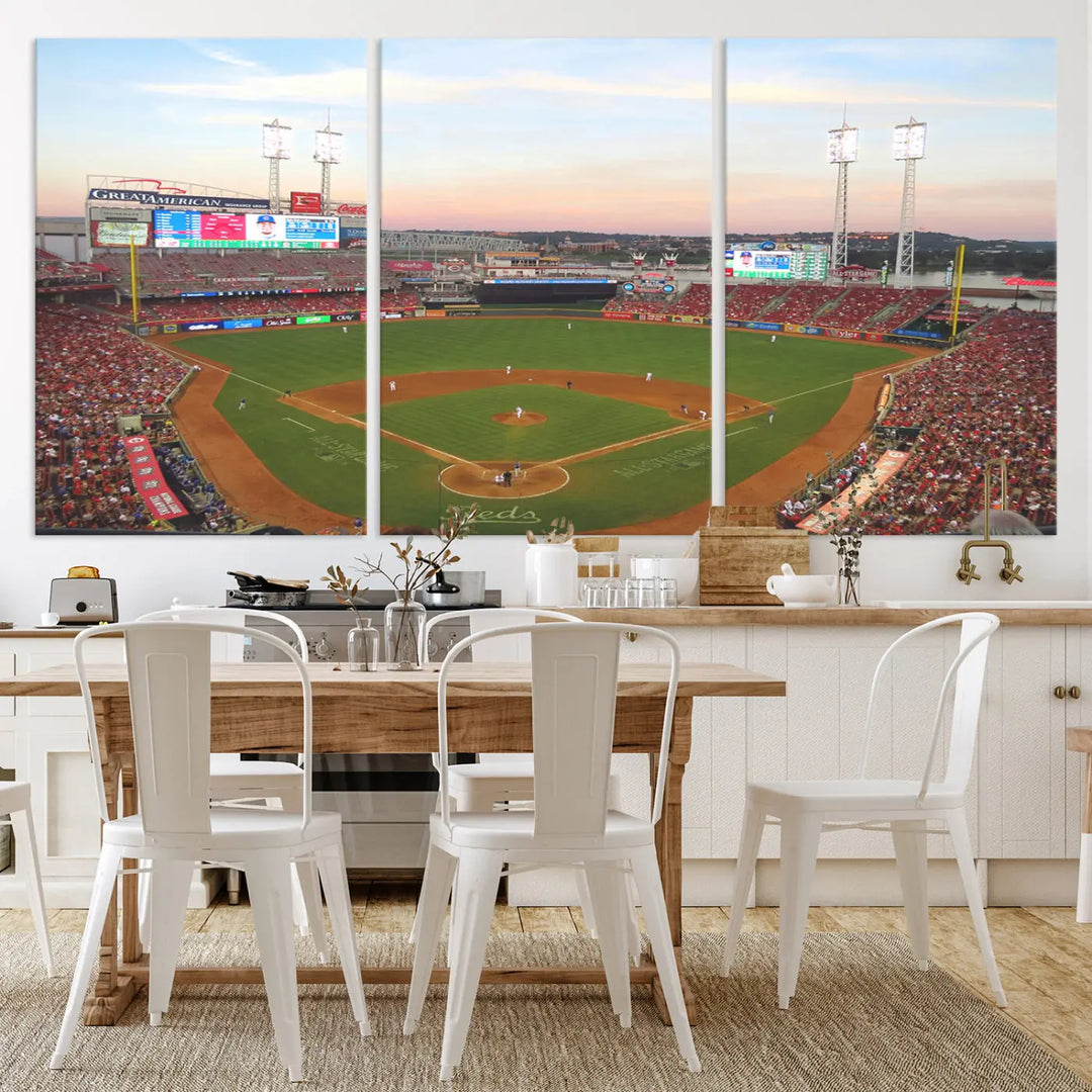 A canvas print of the Cincinnati Reds Baseball Team features a stunning image of the Great American Ball Park at sunset.